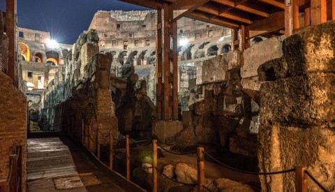 Explore the eerie underground spaces of the Colosseum at night, where gladiators awaited their turn on the arena above