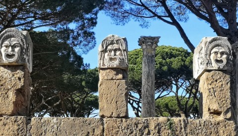 Gaze on amazing sculptures of classical theatrical masks in Ostia's theatre