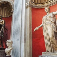 Admire the Porphyry basin and statue of Hercules in the Round Room