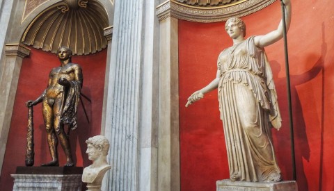 Admire the Porphyry basin and statue of Hercules in the Round Room