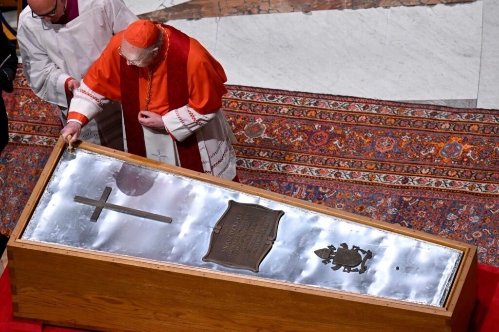 Cardinal Kevin Farrell (the current Camerlengo) affixes his Seal to Pope Francis' Coffin