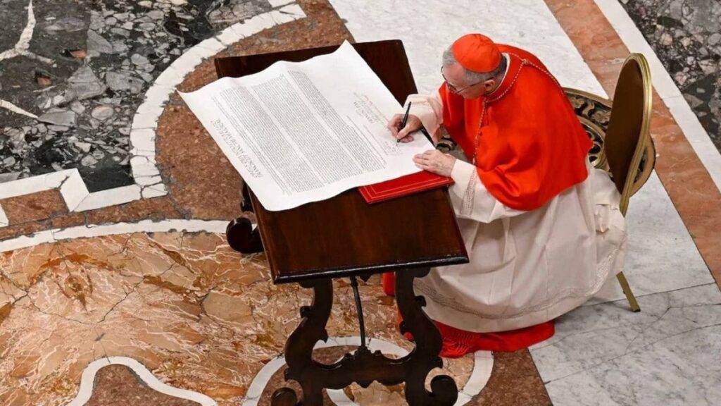 Cardinal Keven Farrell signs the 'Rogito' during the casket closing ceremony of Pope Francis