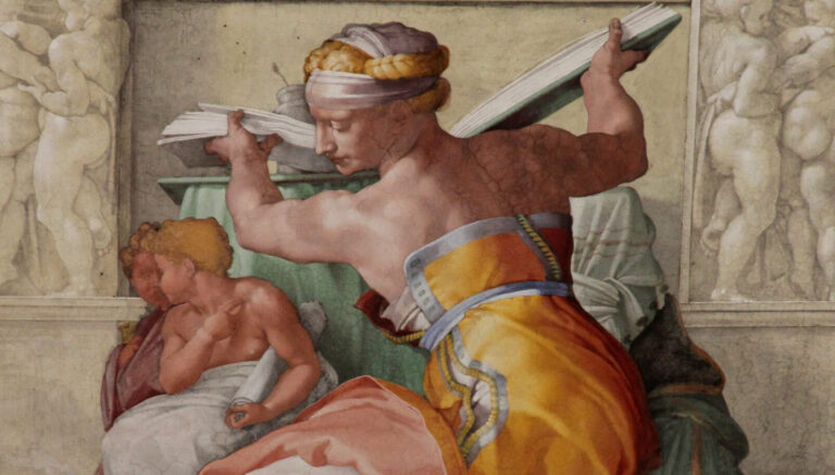 a sibyl holding a book painted by michelangelo in the sistine chapel