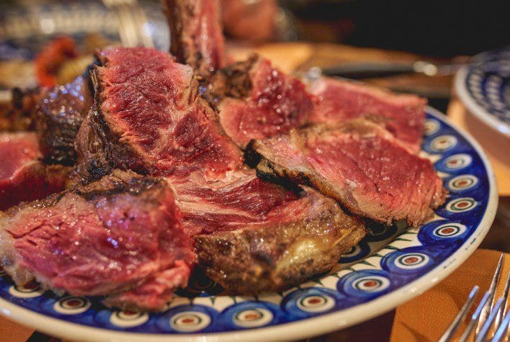 Bistecca alla Fiorentina served rare in the traditional fashion