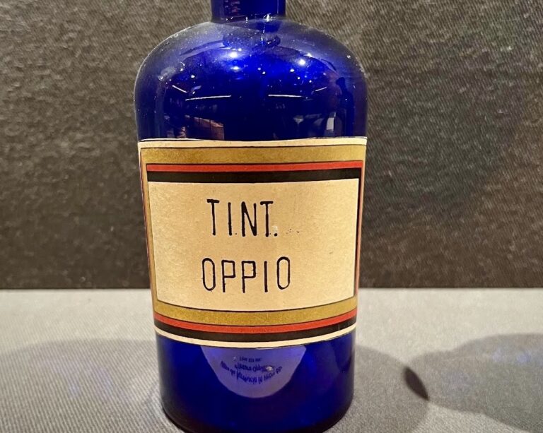 Blue apothecary bottle in the museum of the crypt of the capuchins in Rome