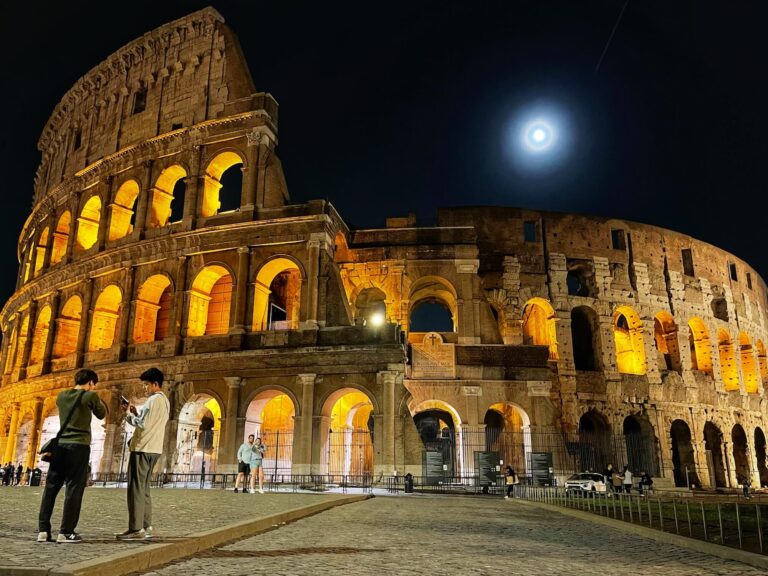 the colosseum shimmers at night