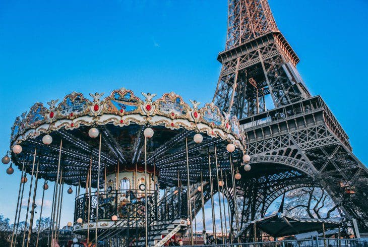Eiffel Tower in Paris with a vintage carousel in the foreground