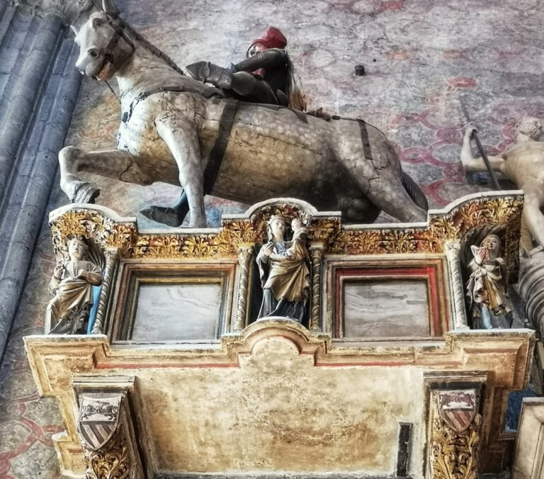an equestrian monument in the massive frari basilica in venice