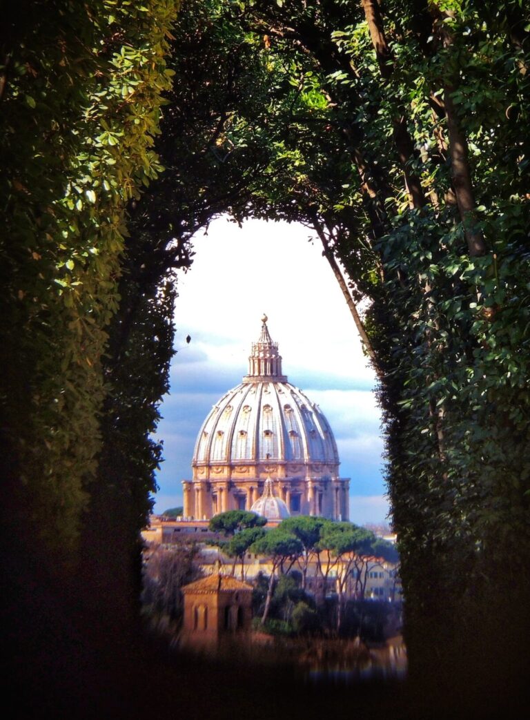The view through the keyhole of Villa Magistrale belonging to the Knights of Malta on the aventine Hill in Rome... The view shows the dome of St Peter's Basilica perfectly framed at the end of the garden path surrounded by an avenue of bushes