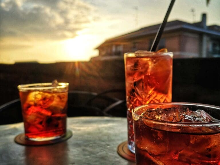 Negroni and Spritz With a Sunset Background