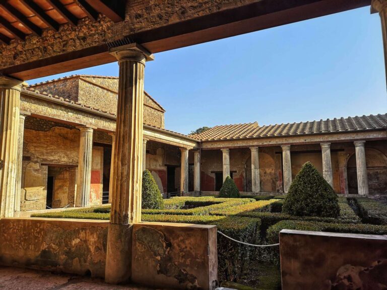 atrium of the House of Menander in Pompeii showinf a colonnaded inner courtyard with decorative box hedging in the centre