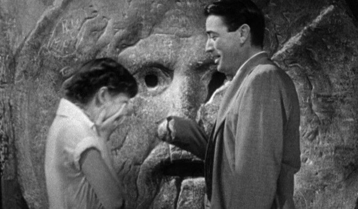 Audrey Hepburn & Gregory Peck in The film Roman Holiday at the Bocca della Verità with Gregory Peck pretending that his hand has been bitten off by the Mouth of Truth