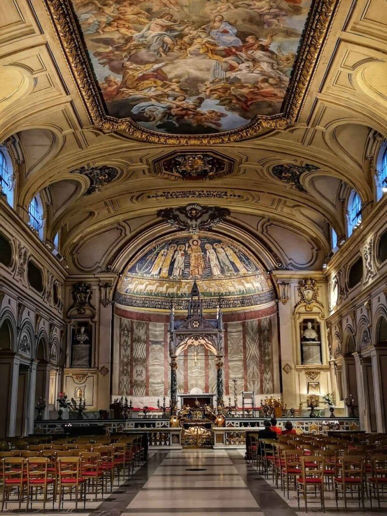Interior view of the church of Santa Cecilia in Trastevere Rome with a view up the nave to the main altar