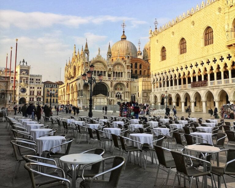 saint marks square in venice with tables