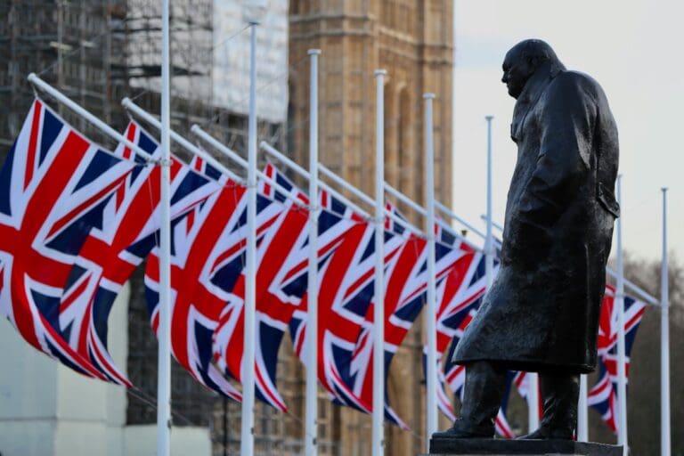 Statue of Winston Churchill flanked by the Union Jack