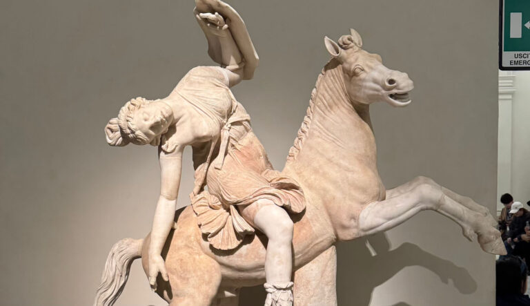 an ancient sculpture from the naples archaeological museum showing a rider on a horse
