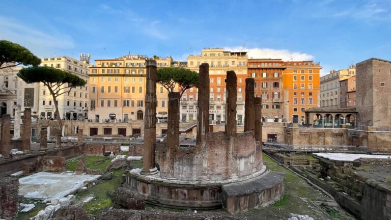 a panoramic view of largo argentina in rome with its ancient temples
