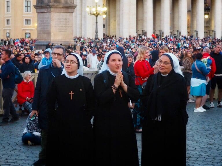 nuns praying in saint peter's square