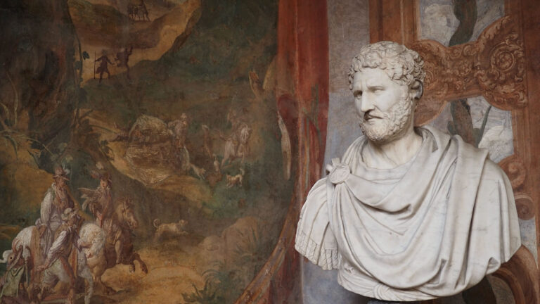 a statue with fresco behind at palazzo altemps