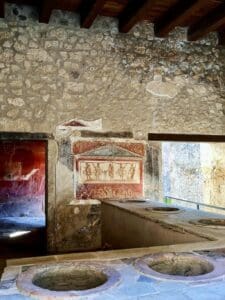 a view into the thermopolium, or fast food restaurant of pompeii