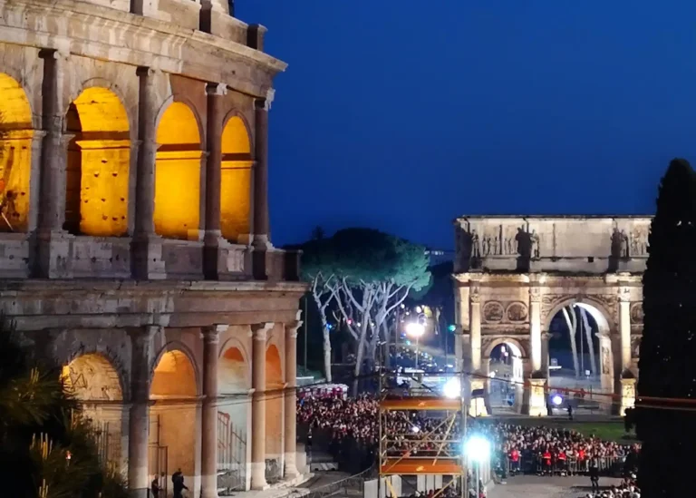 the crowds at the via crucis outside the colosseum in rome