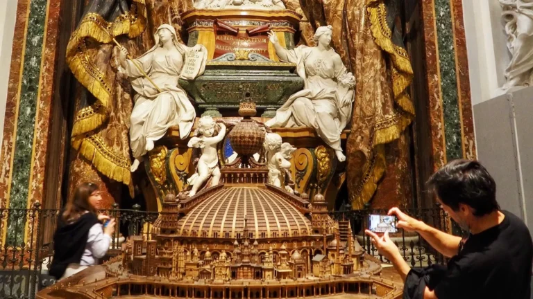 a visitor takes a photo of a tomb in sant'ignazio in rome