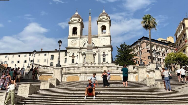 a man sits on the spanish steps