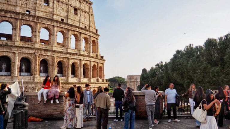 people looking out over the colosseum in rome