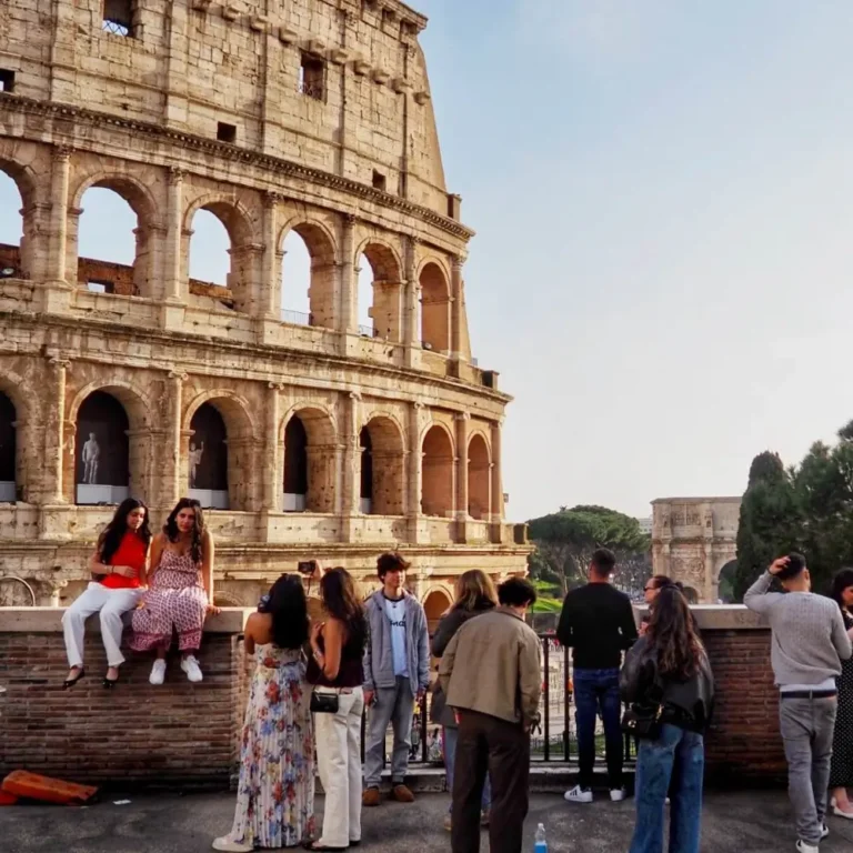 people looking out over the colosseum in rome