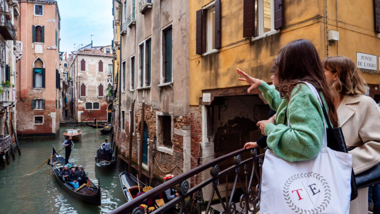 A Through Eternity Guide leads a tour through Venice