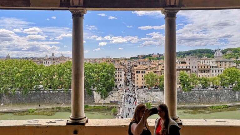 two women take a selfie on the balcony of Castel Sant'Angelo