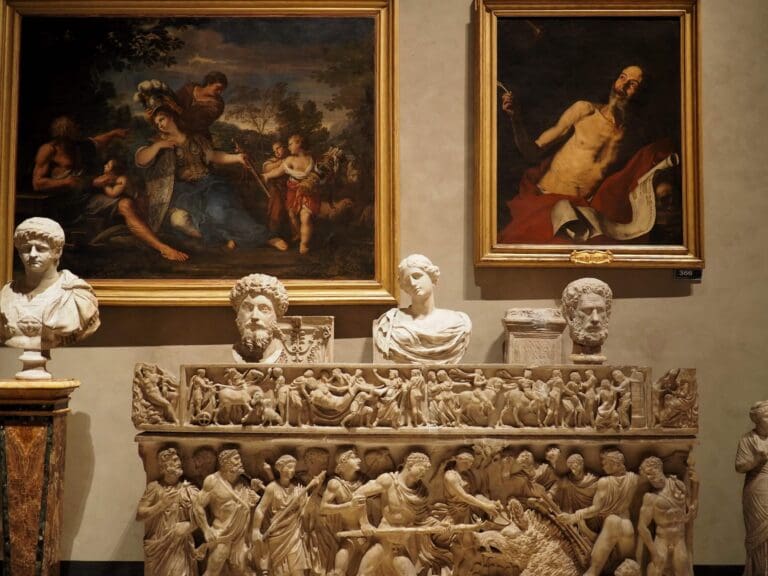 a statue with fresco behind at palazzo altemps